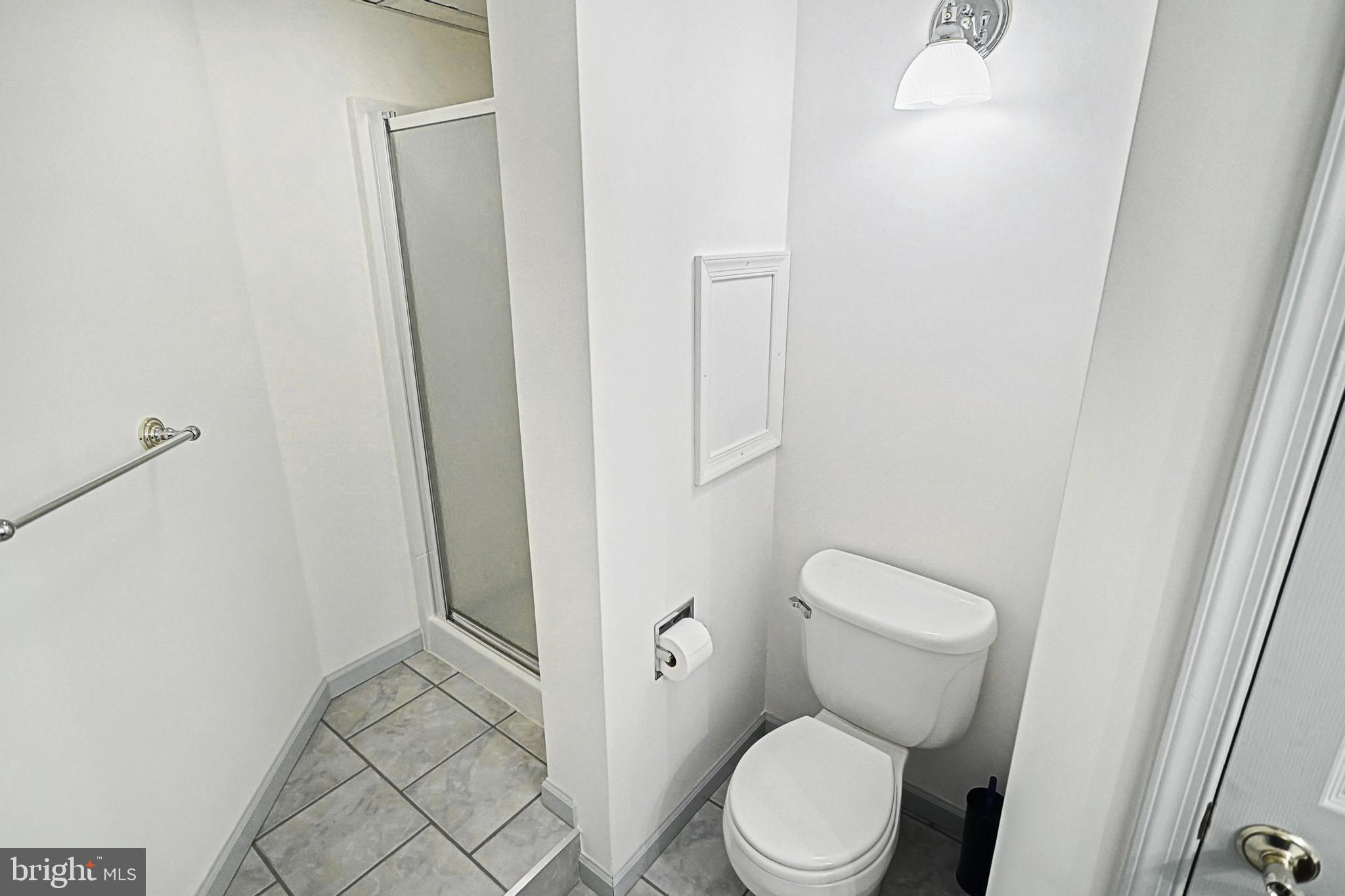 645 Kindig Road Littlestown, PA 17340 - Photo 49 of 61 a white toilet sitting next to a shower