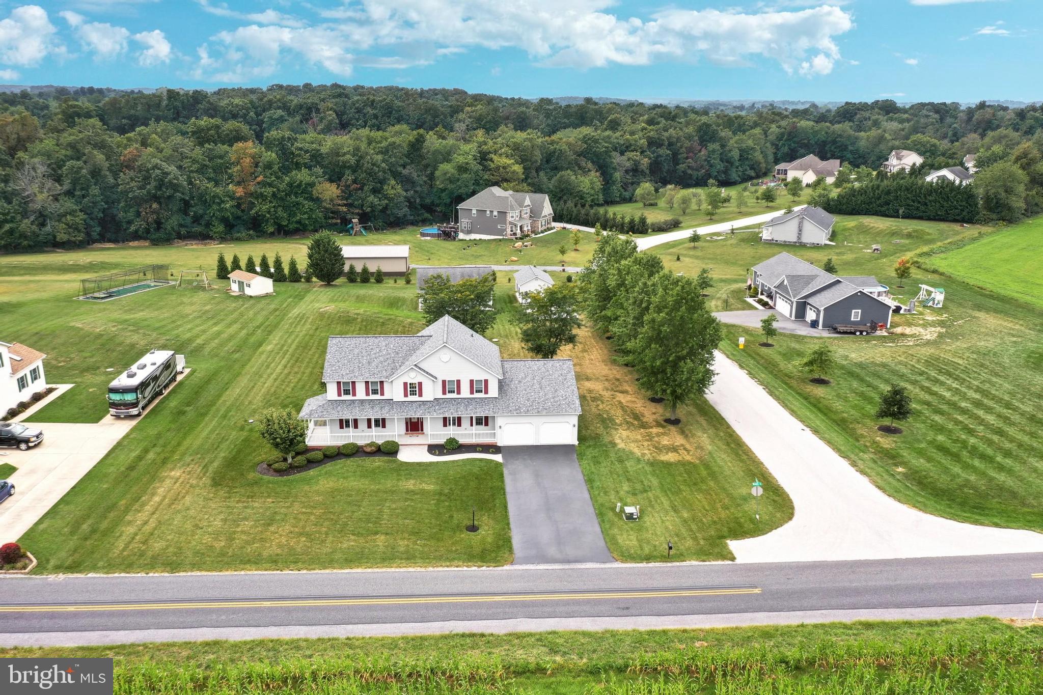 645 Kindig Road Littlestown, PA 17340 - Photo 55 of 61 an aerial view of a house with pool big yard and large trees