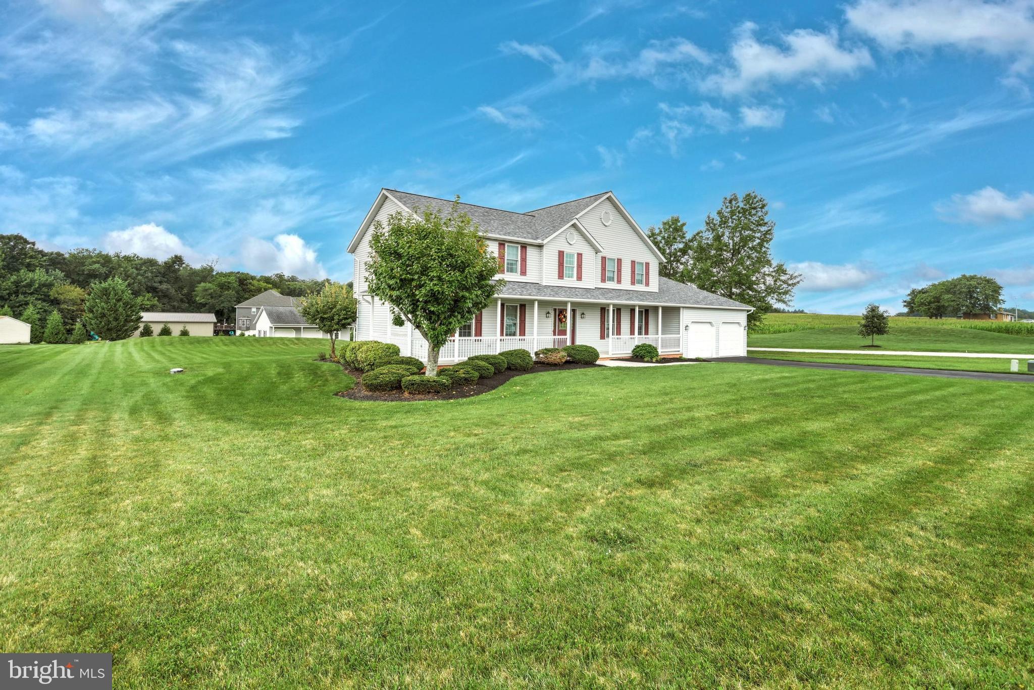 645 Kindig Road Littlestown, PA 17340 - Photo 6 of 61 a front view of a house with a garden