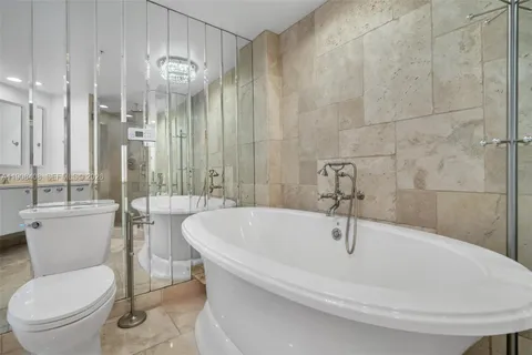 a bathroom with a shower and a sink