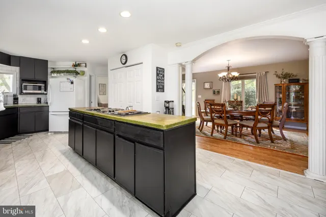 a kitchen with stainless steel appliances granite countertop a stove and a sink