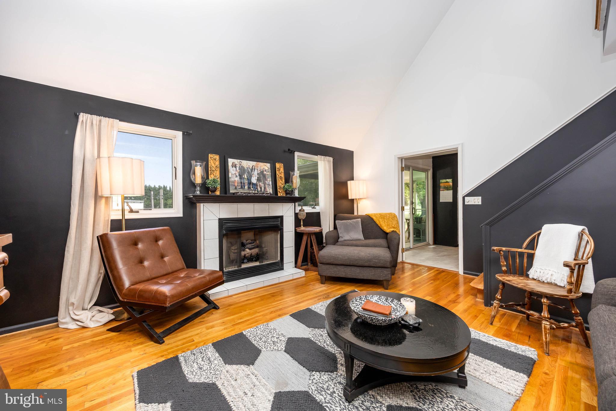 26882 Pratt Road Salisbury, MD 21801 - Photo 25 of 80 a living room with furniture and a fireplace