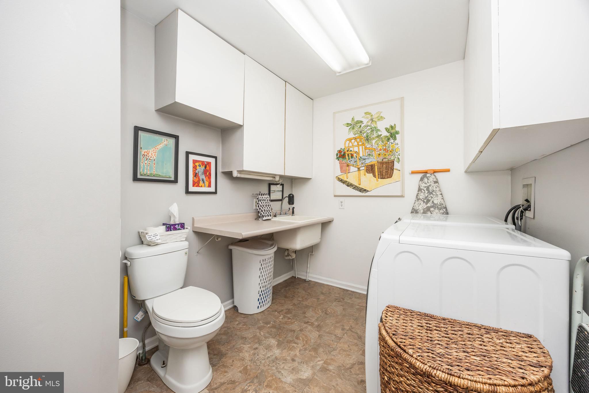 26882 Pratt Road Salisbury, MD 21801 - Photo 28 of 80 a bathroom with a sink a toilet and a window