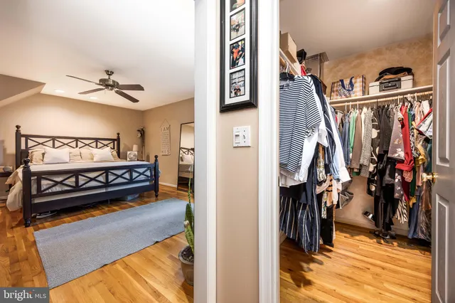 a bathroom with a granite countertop toilet sink and a mirror