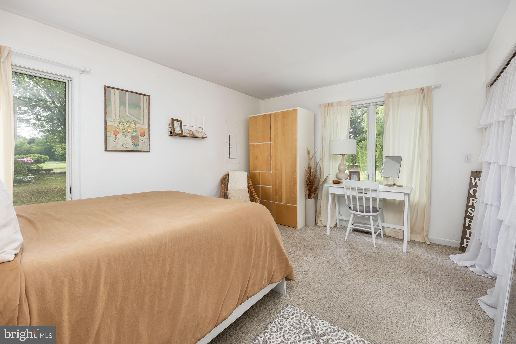 26882 Pratt Road Salisbury, MD 21801 - Photo 41 of 80 a bedroom with a bed and a large window