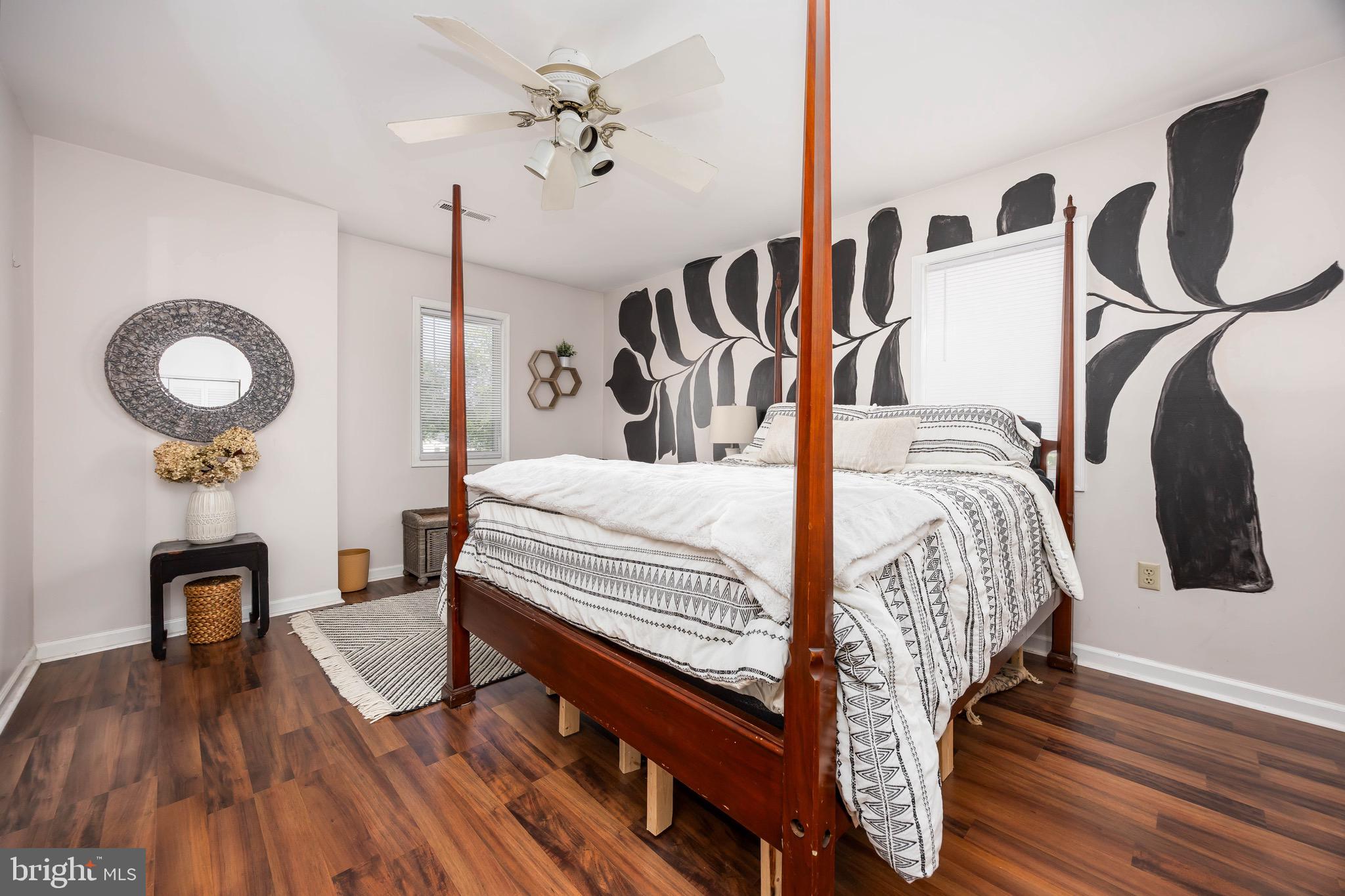 26882 Pratt Road Salisbury, MD 21801 - Photo 47 of 80 a bedroom with a bed and a chandelier