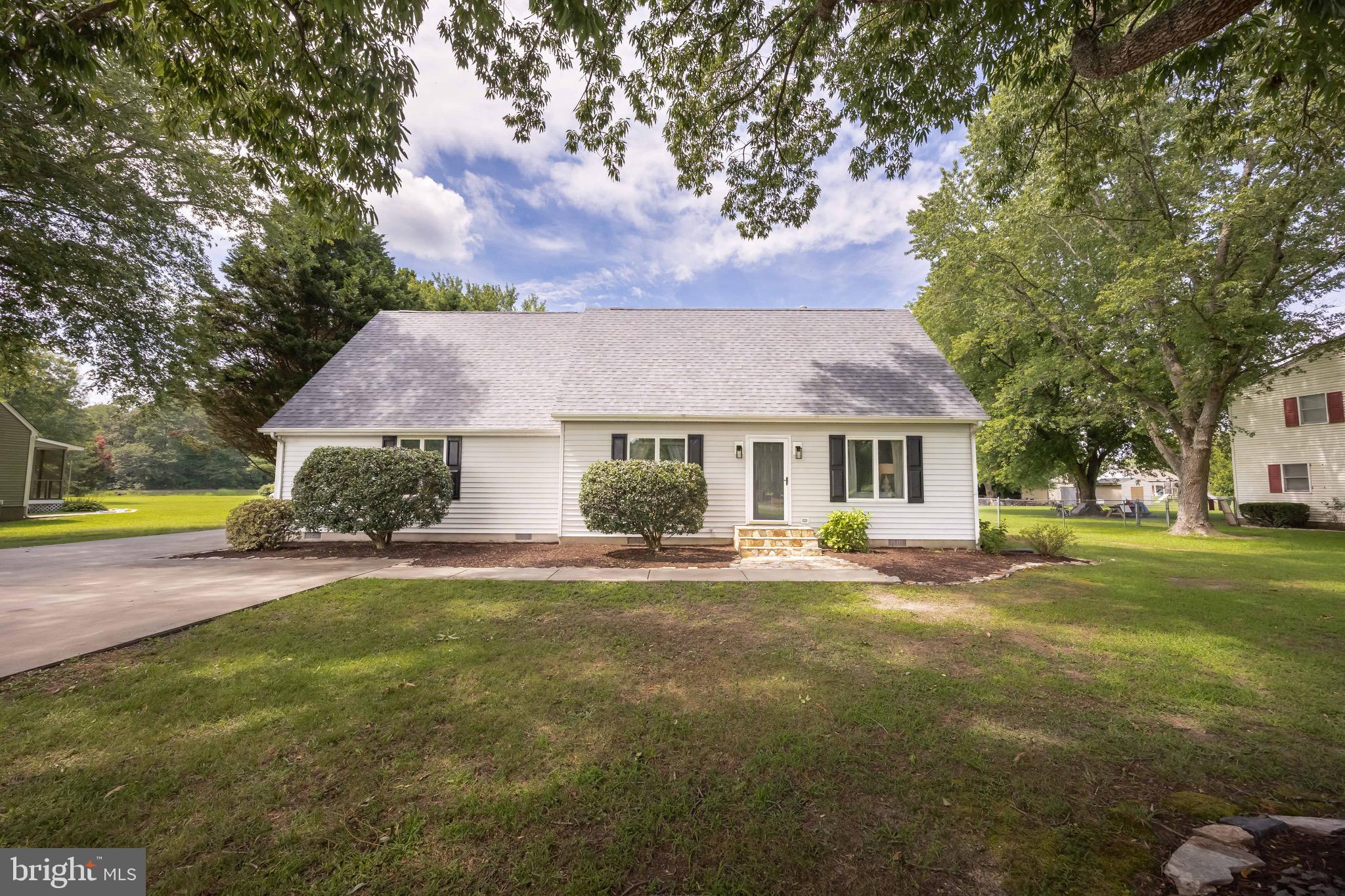 26882 Pratt Road Salisbury, MD 21801 - Photo 7 of 80 a front view of a house with a garden and trees