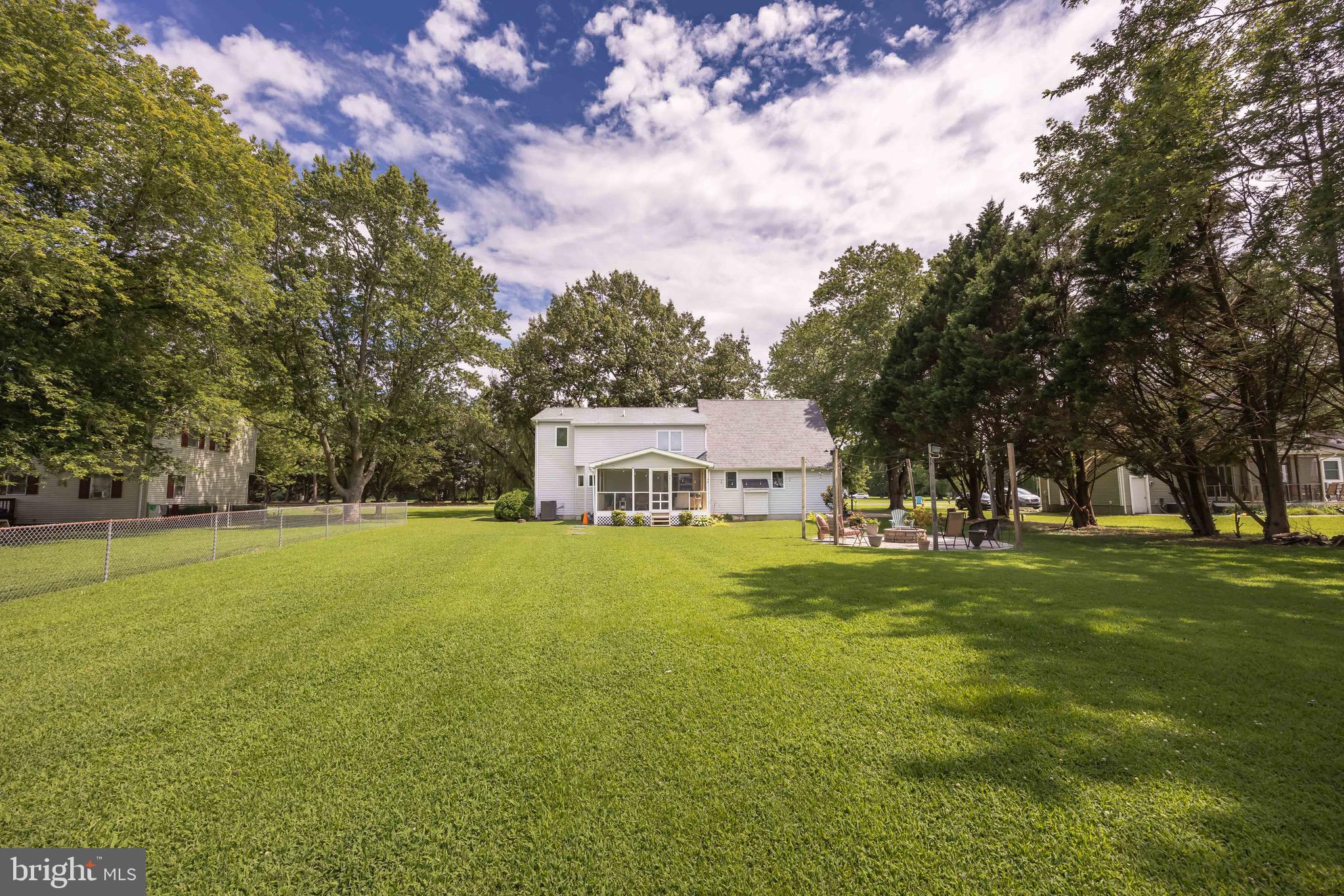 26882 Pratt Road Salisbury, MD 21801 - Photo 74 of 80 a house view with swimming pool in front of it and trees