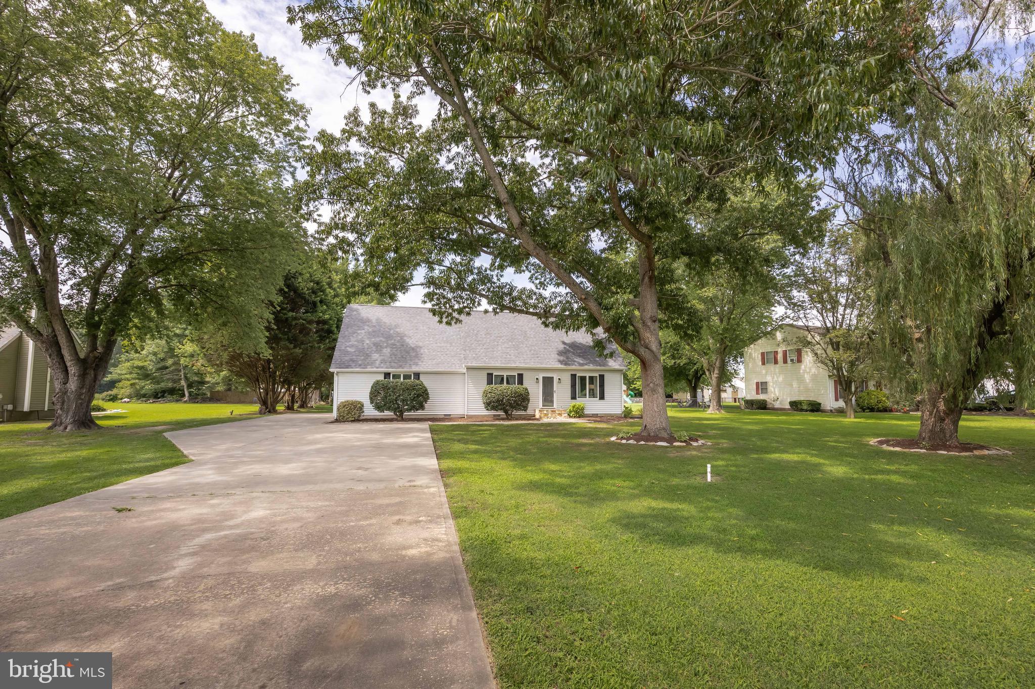 26882 Pratt Road Salisbury, MD 21801 - Photo 9 of 80 a front view of a house with a yard and trees