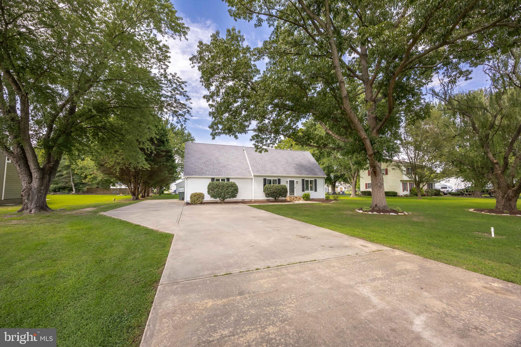 26882 Pratt Road Salisbury, MD 21801 - Photo 10 of 80 a front view of a house with garden and trees