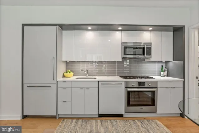 a kitchen with a stove and a microwave