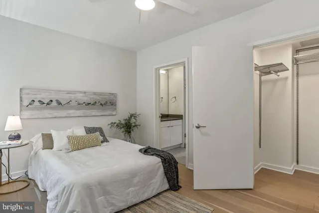 a bedroom with a bed and a table