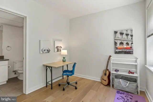 a workspace with furniture and wooden floor