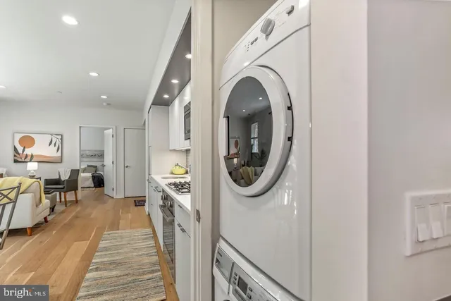 a view of a hallway with washer and dryer