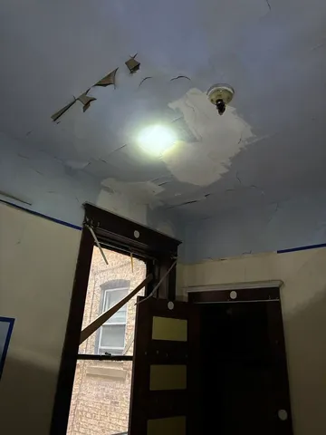 a kitchen with windows and sink