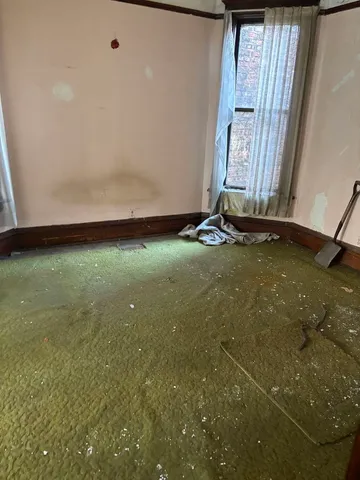 a view of a fireplace with wooden floor