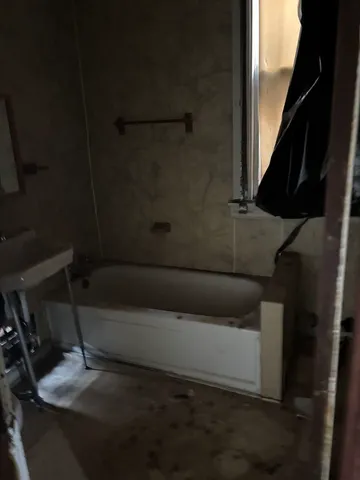 a view of a fireplace with a window