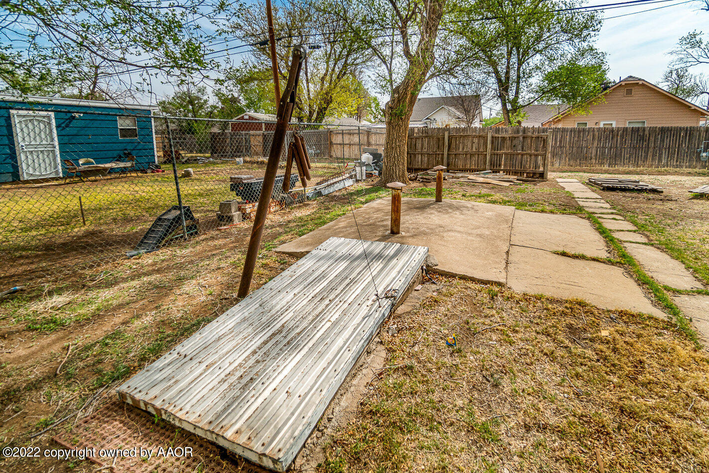 3711 South Harrison Street Amarillo, TX 79110 - Photo 19 of 20 a view of a backyard with wooden fence