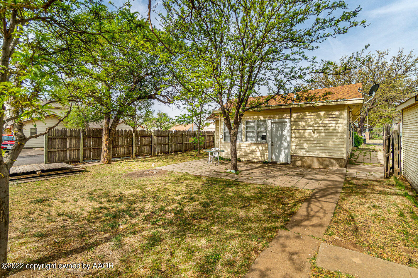 3711 South Harrison Street Amarillo, TX 79110 - Photo 20 of 20 a view of yard with swimming pool and trees