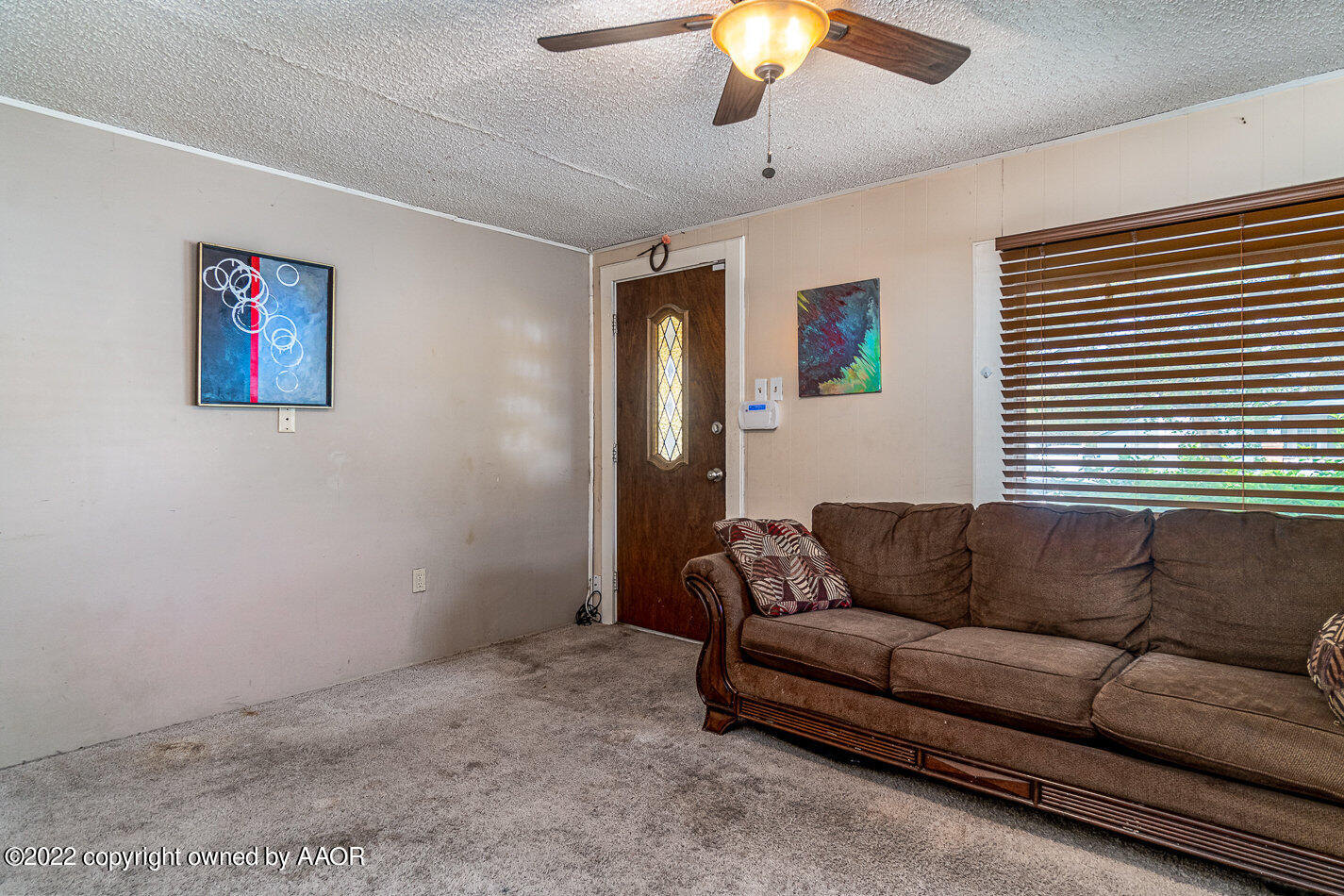 3711 South Harrison Street Amarillo, TX 79110 - Photo 4 of 20 a living room with furniture and a window