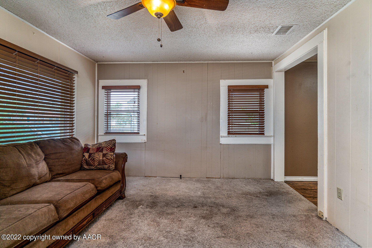 3711 South Harrison Street Amarillo, TX 79110 - Photo 6 of 20 a living room with furniture and a window