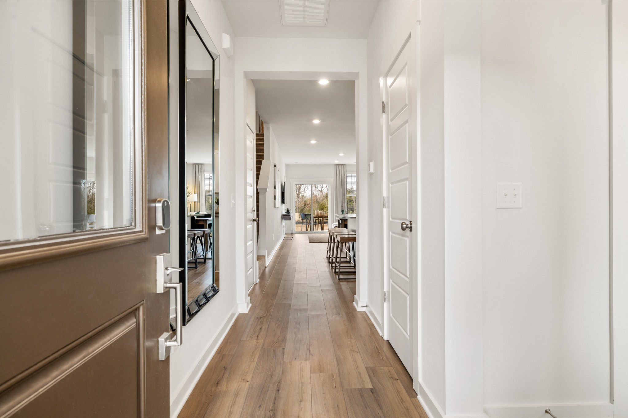 434 Alcott Way Spring Hill Spring Hill, TN 37174 - Photo 3 of 18 a view of a hallway with wooden floor and staircase
