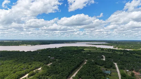 a view of a lake with a yard