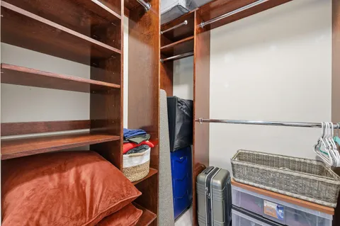 a bedroom with a bed and a closet