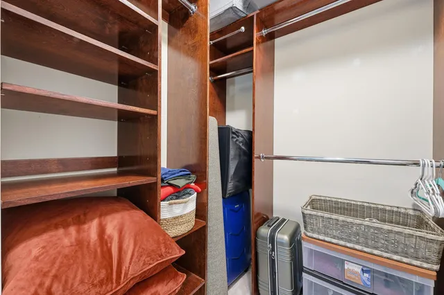 a bedroom with a bed and a closet