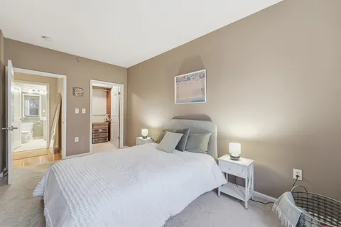 a bedroom with a bed and a closet