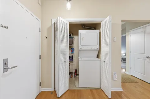 a kitchen with a refrigerator and a sink