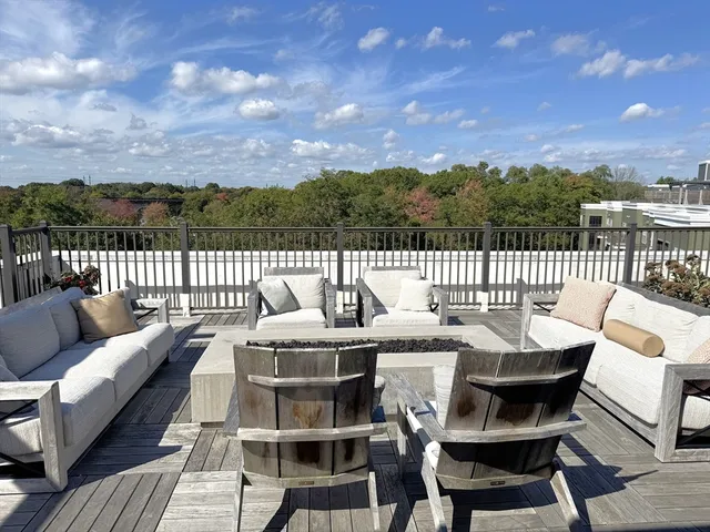 a dining area with a table and chairs
