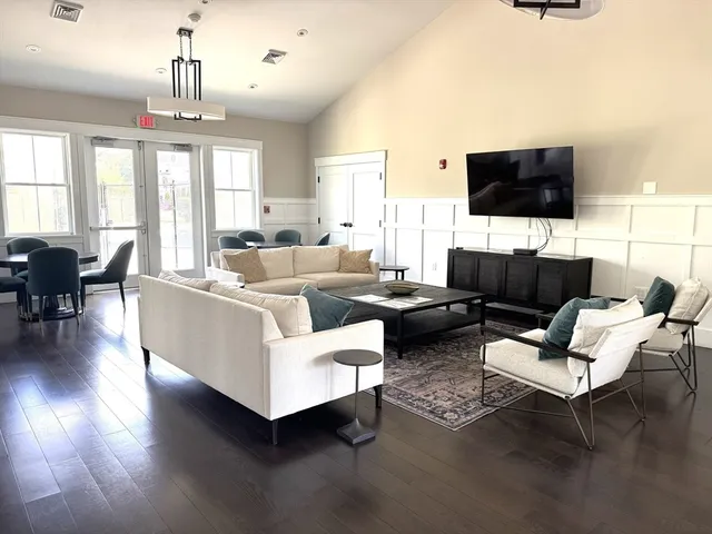 a view of a a dining room with furniture window and outside view