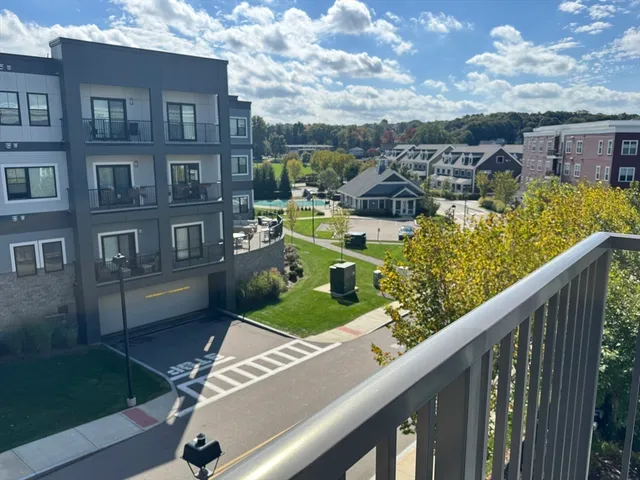 a kitchen with a refrigerator sink and cabinets