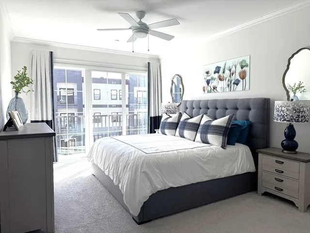 a bedroom with bed and wooden floor