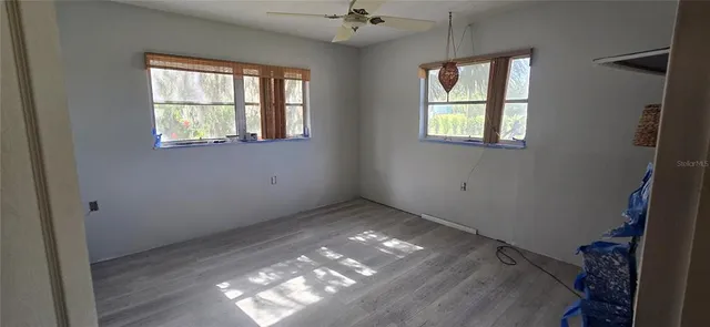 an empty room that has a window in it