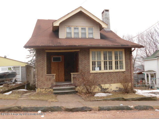 139 Spring Street Carbondale, PA 18407 - Photo 1 of 25 a front view of a house with a yard
