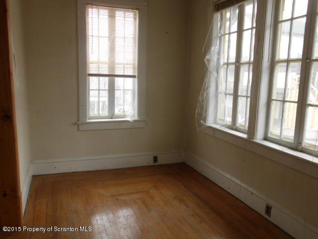 139 Spring Street Carbondale, PA 18407 - Photo 2 of 25 a view of an empty room with a window