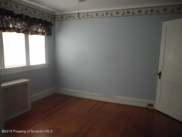 139 Spring Street Carbondale, PA 18407 - Photo 21 of 25 a view of a room with racks on the wall