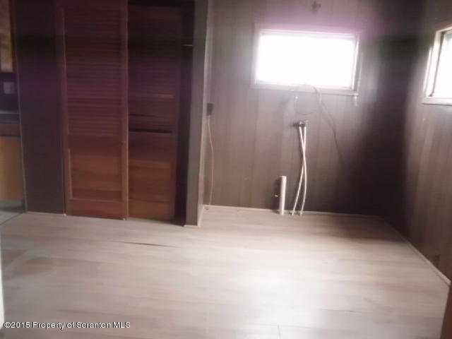 139 Spring Street Carbondale, PA 18407 - Photo 7 of 25 an empty room with windows