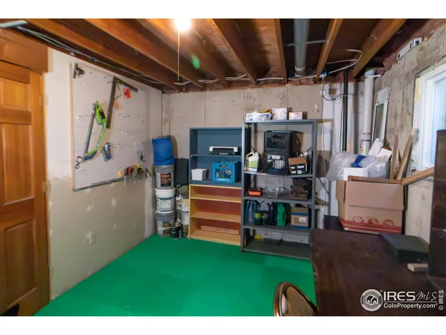 a view of living room filled with furniture and a fireplace