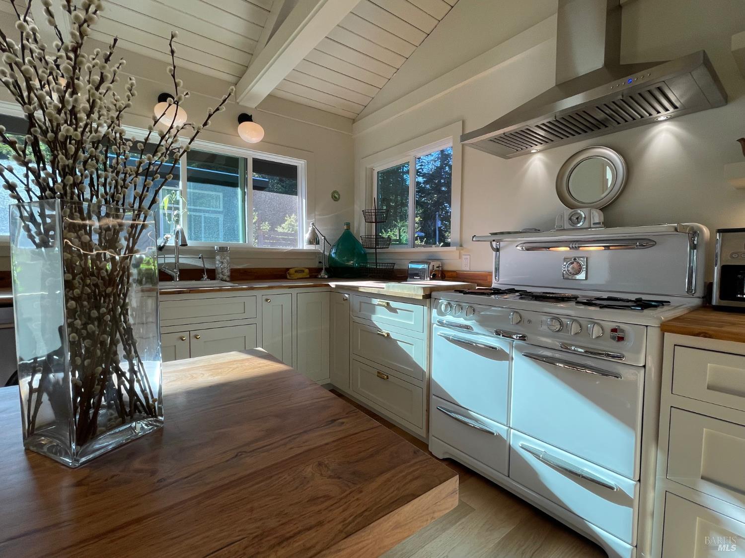 28800 Seaview Road Cazadero, CA 95421 - Photo 6 of 14 a kitchen with sink stove and cabinets