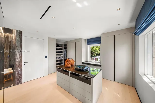 a kitchen with stainless steel appliances granite countertop a stove and a refrigerator