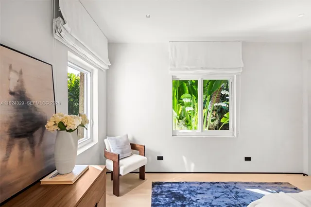 a view of room with furniture and a window