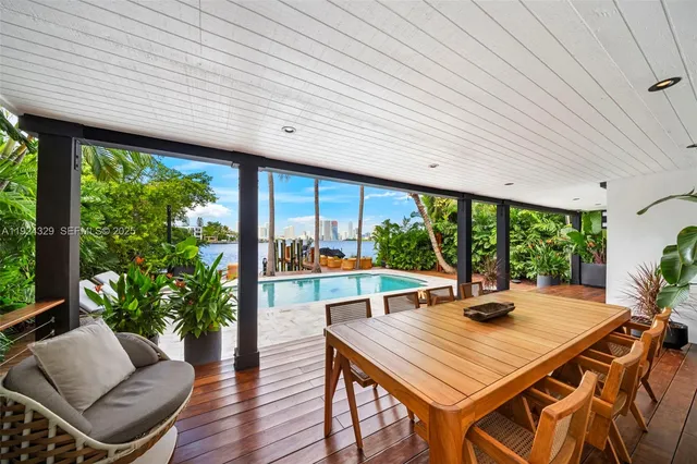 a view of a patio with a table and chairs