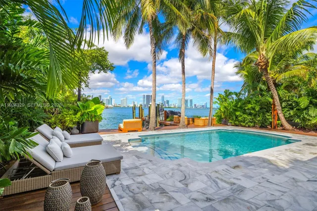 a view of a swimming pool with a patio