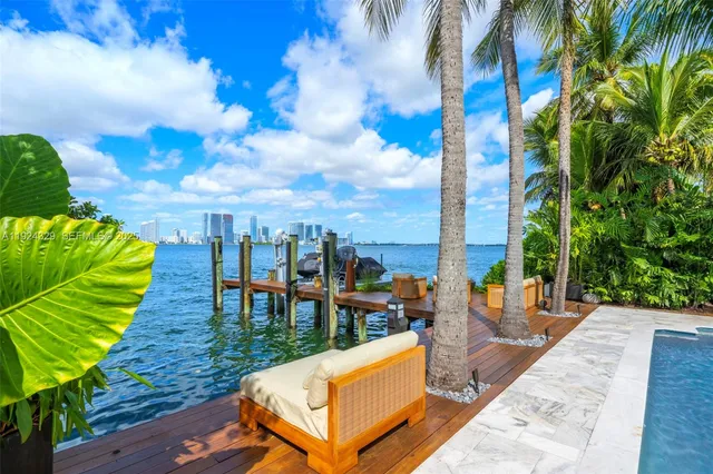 a view of a swimming pool with a lounge chairs