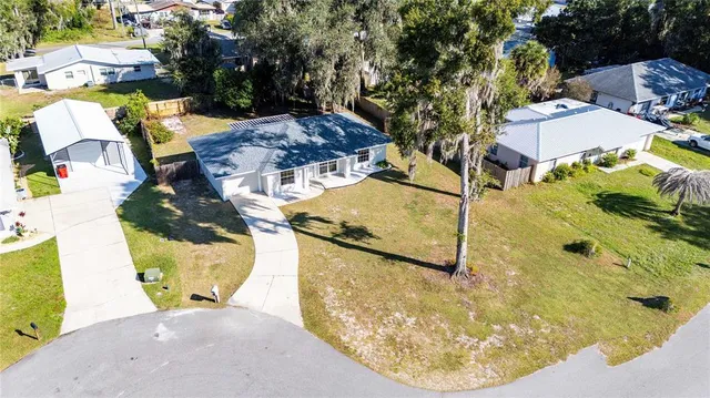 a view of a swimming pool with a yard