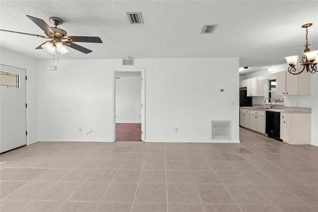 a view of a kitchen with a sink and cabinet