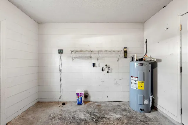 a view of storage and utility room with two washing machine